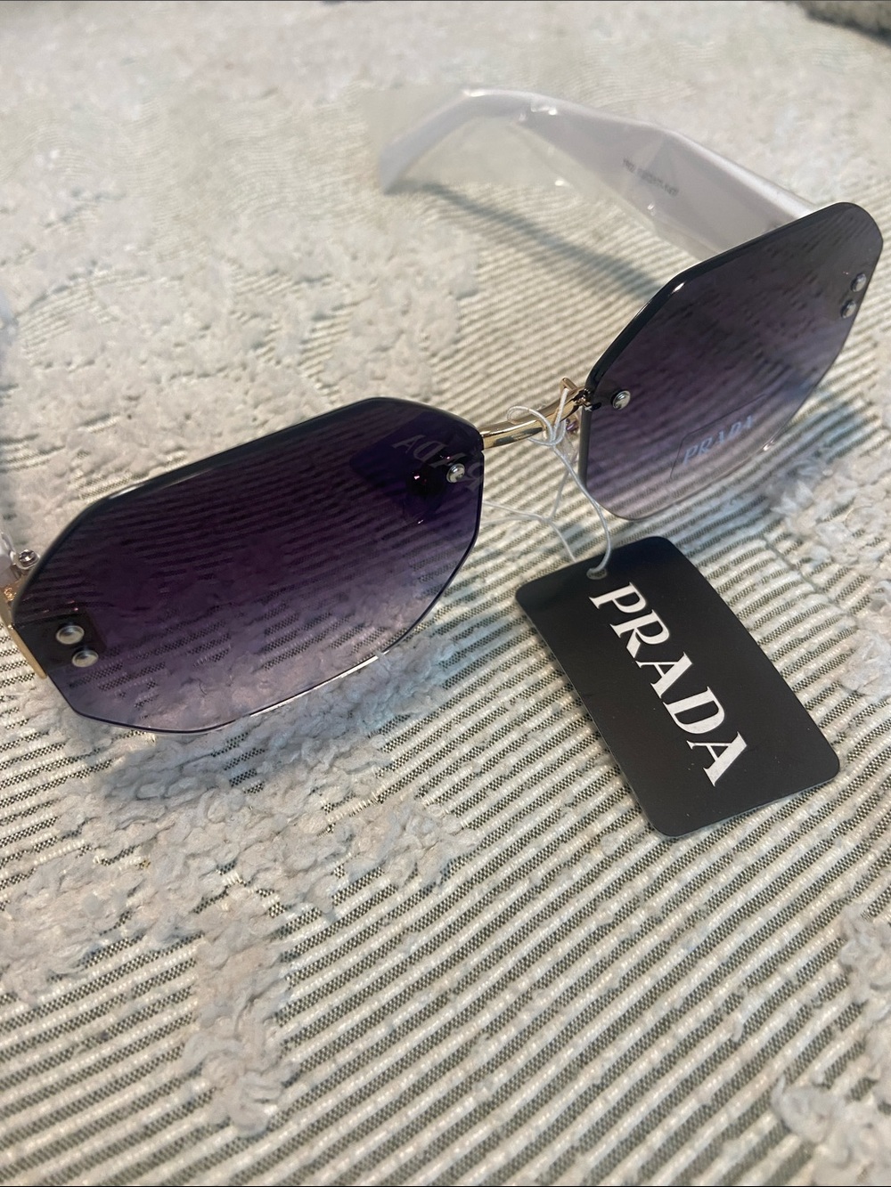 Purple Rimless Sunglasses with White Temples